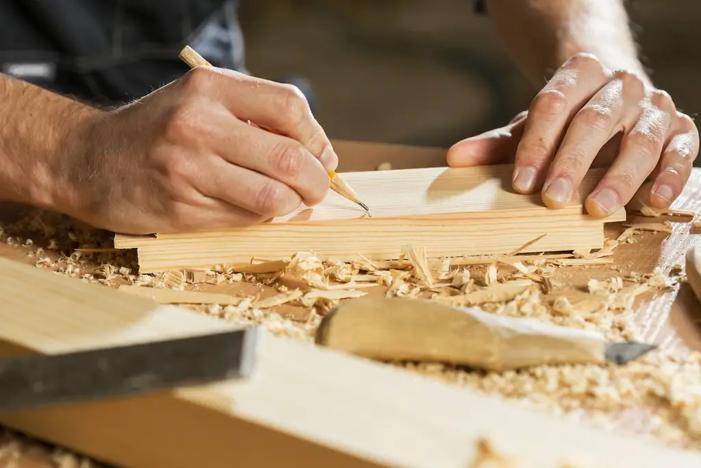 Joiner marking out a timber component